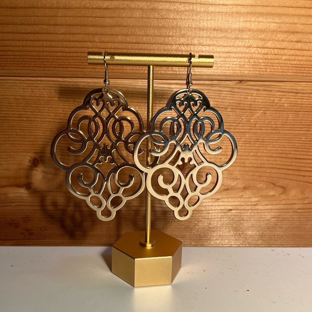 Gold dangling earrings.